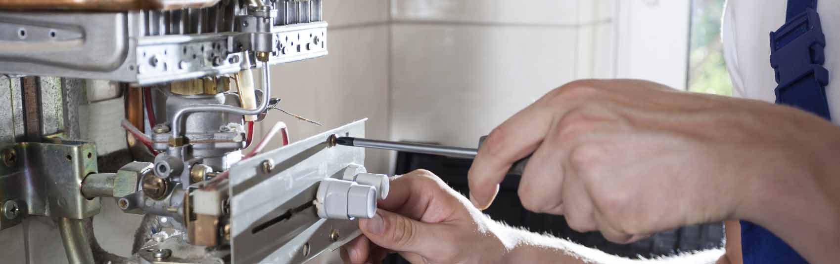 man fixing boiler